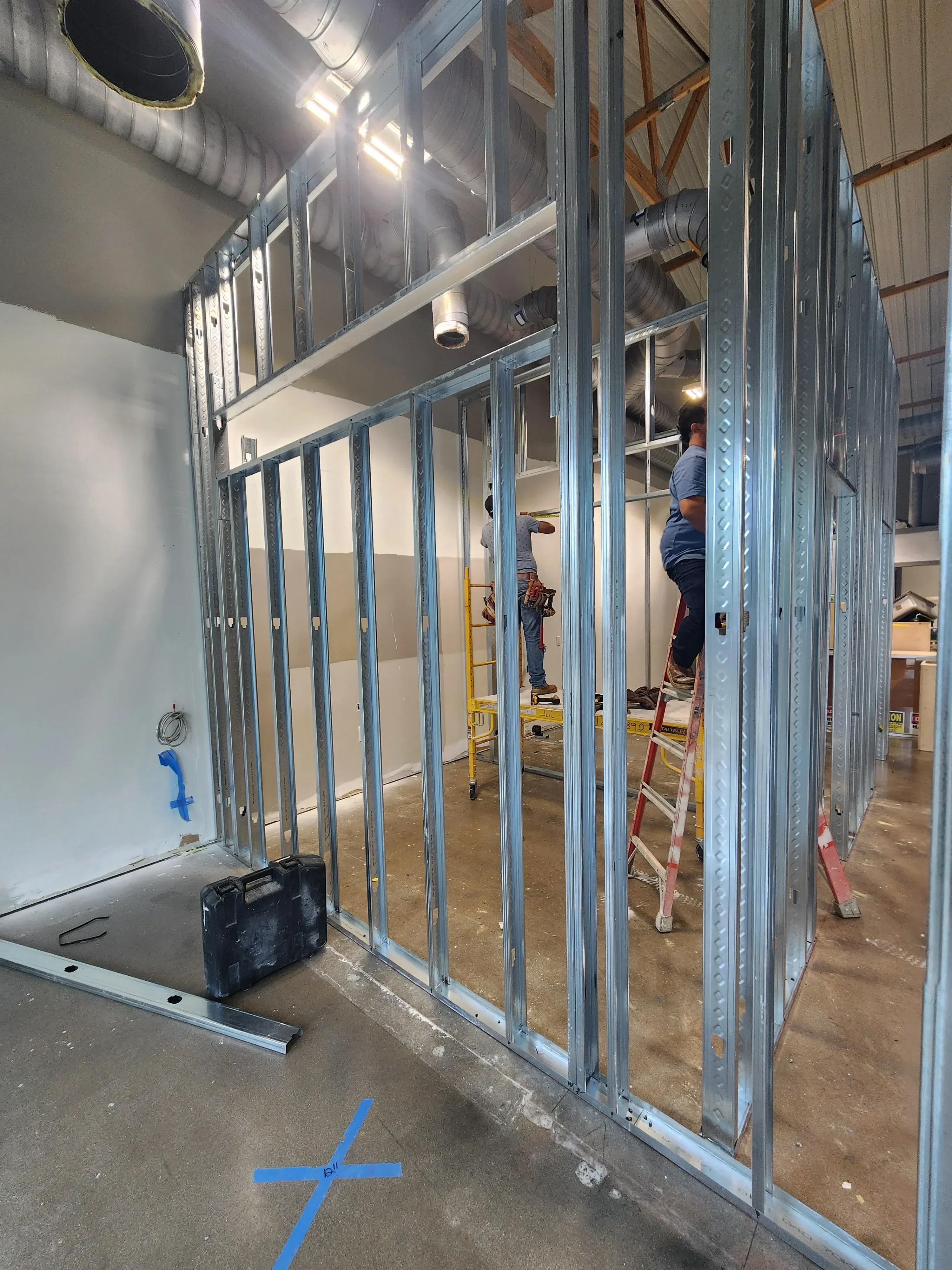 Galvanized steel beam framing with diamond plate decking installed in kitchen remodel